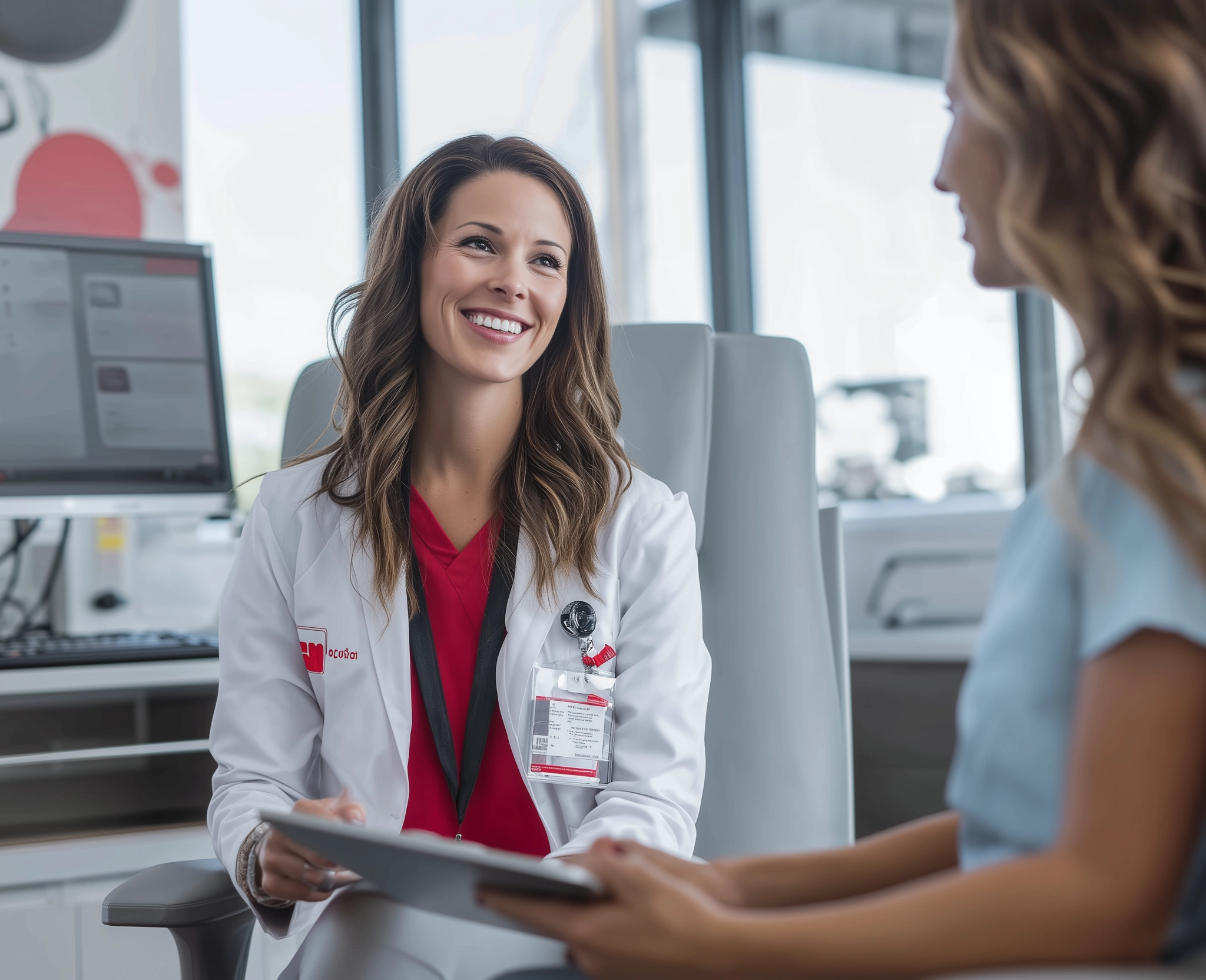 A healthcare team collaborating confidently at their computers
