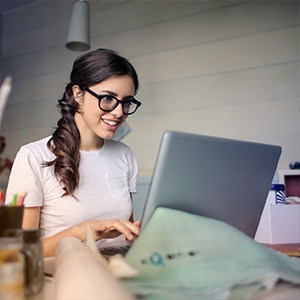 Woman typing on laptop