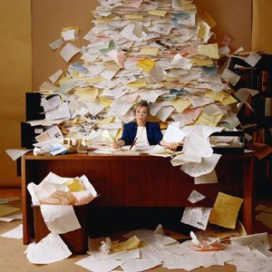 Pile of paper stacked as big as a desk